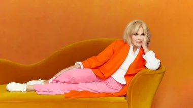 Joanna Lumley on a sofa.