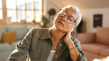 Woman thinking sore neck