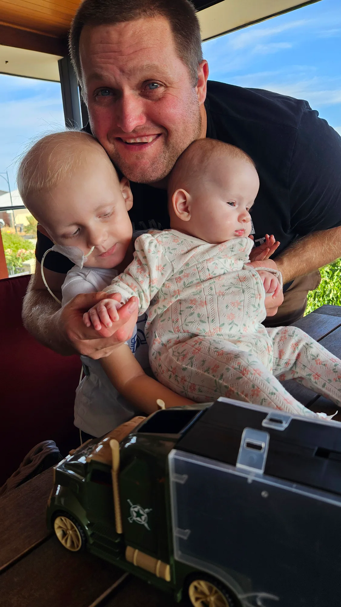 Tommy, dad Dave and baby Aria who was a stem cell transplant donor.
