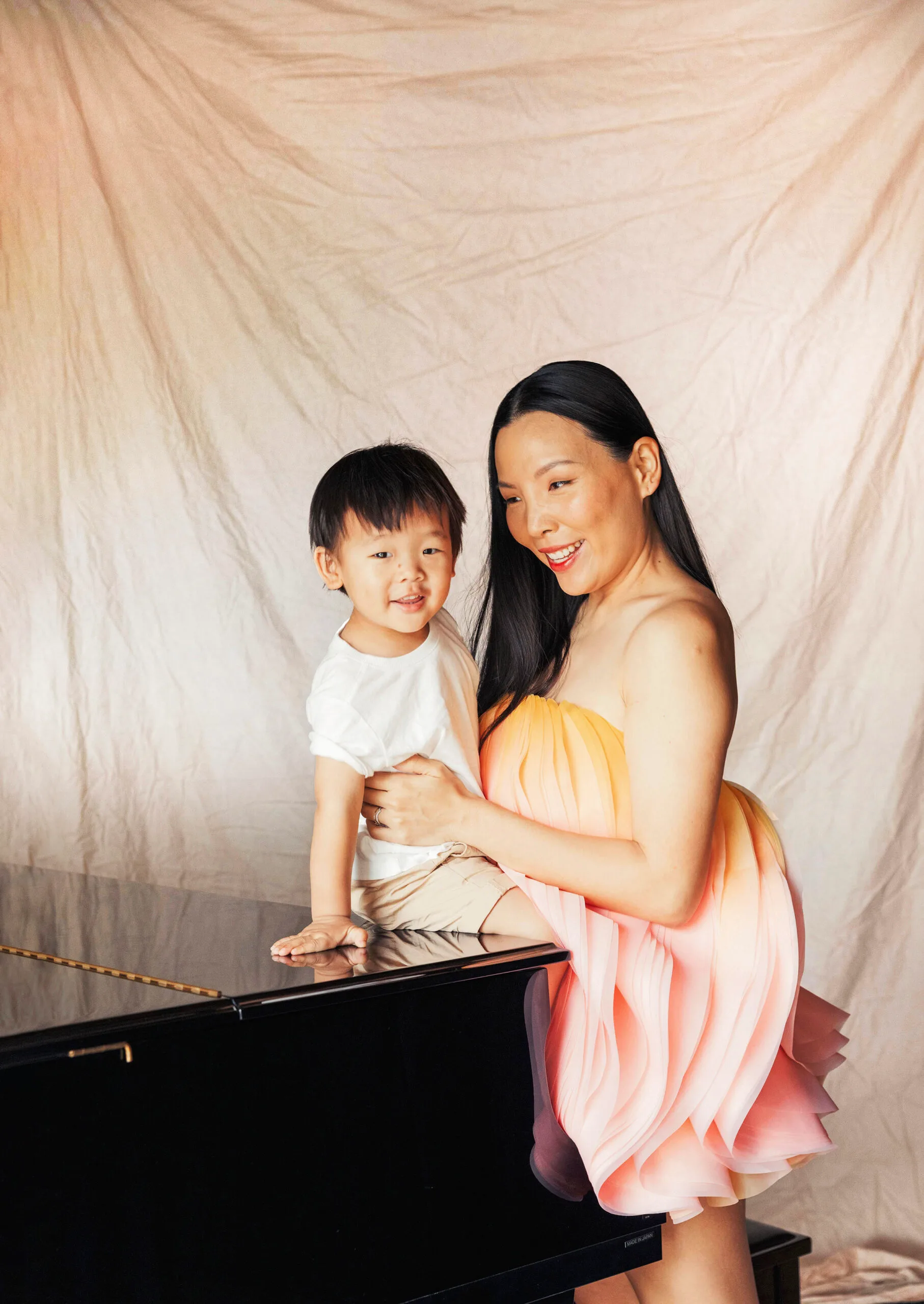 Dami Im and son Harry at the family piano. Photo Grace Elizabeth.