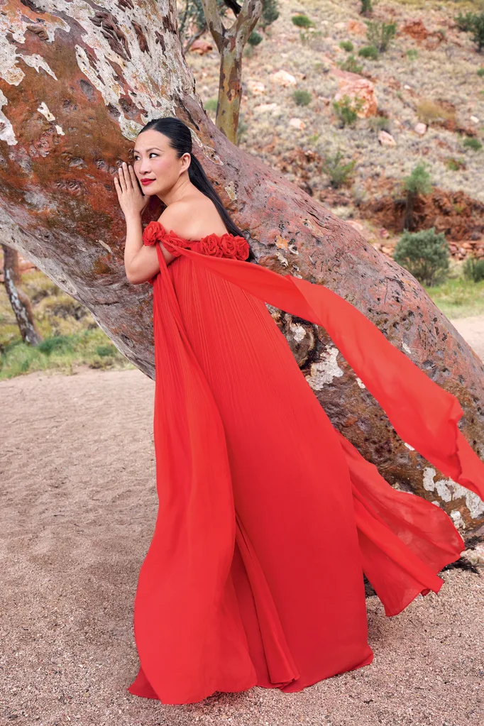 Poh in a red gown in the Northern Territory.