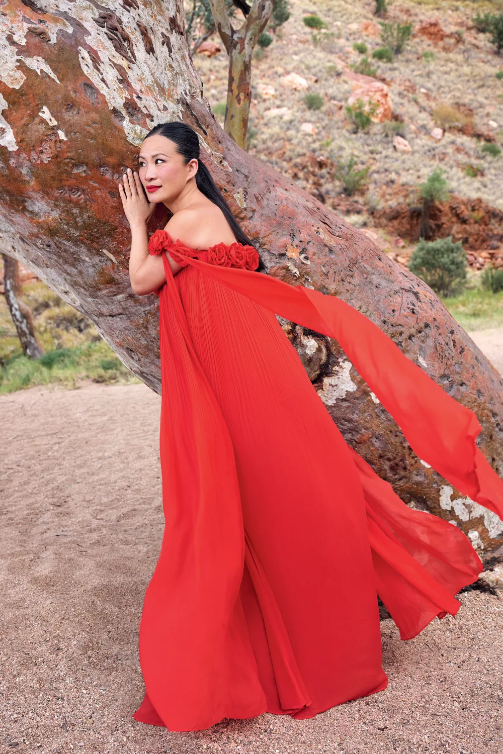 Poh in a red gown in the Northern Territory. 