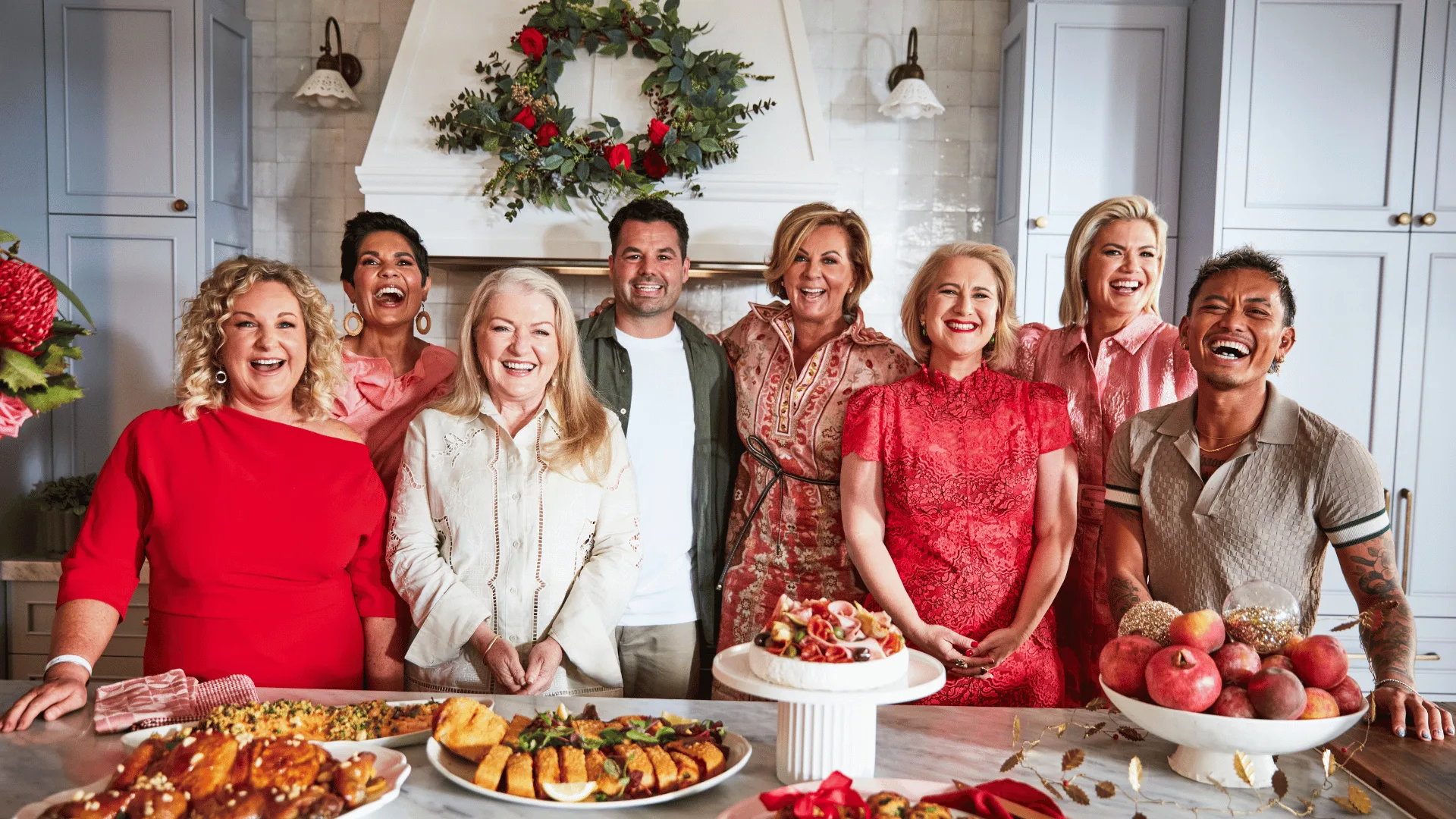 The cast and crew of Christmas With Te Australian Women's Weekly cleebrate around the table