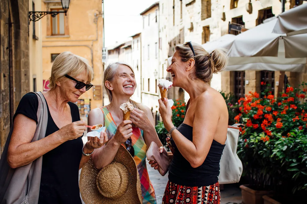 Women eating ice cream together in Italy.
