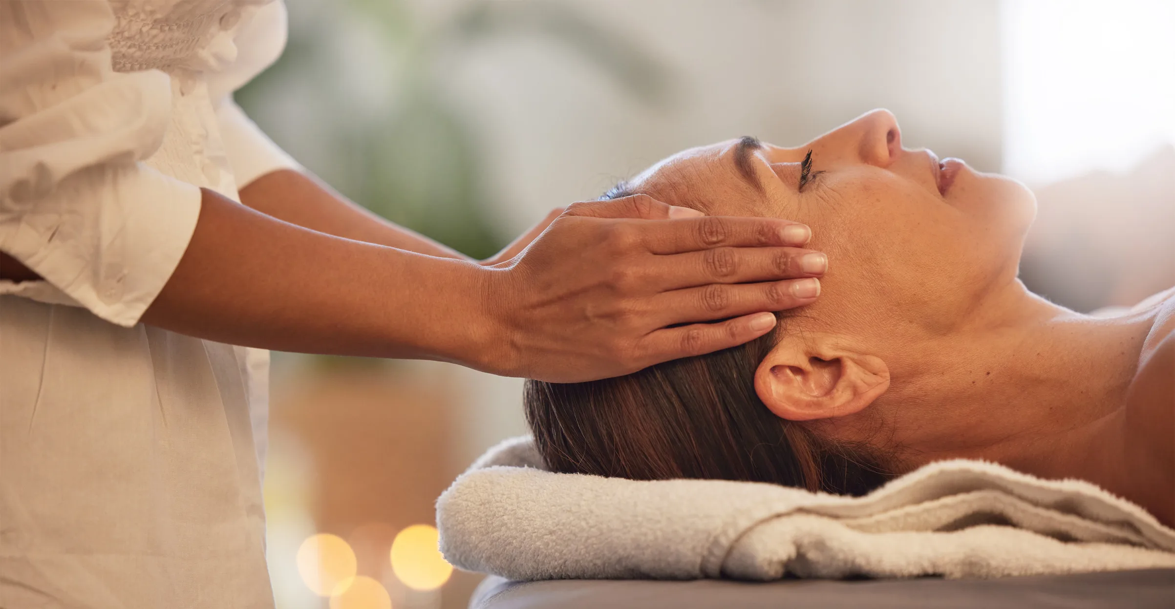 Woman receiving a head massage. 
