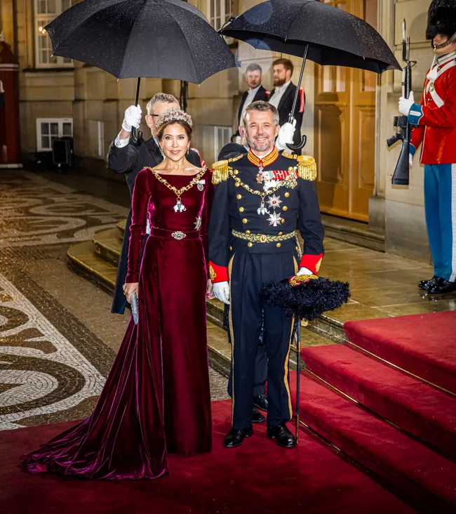Queen Mary and King Frederik in formal attire.