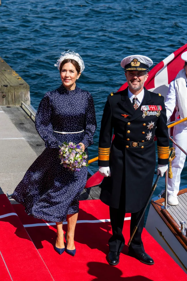 Queen Mary and King Frederik in formal attire.