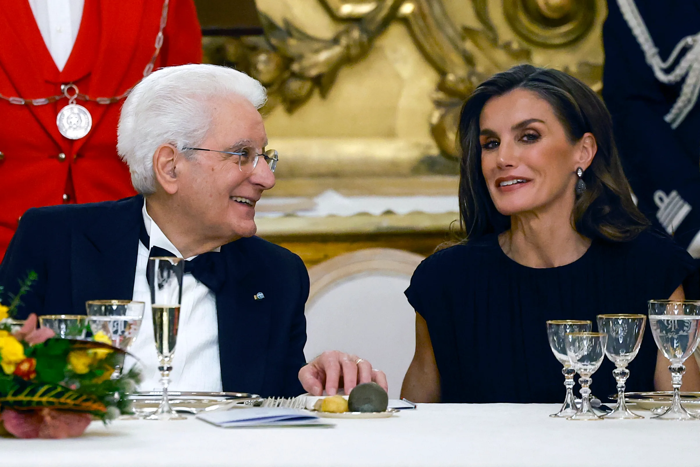 Italian President Sergio Mattarella and Queen Letizia of Spain converse during a gala dinner.