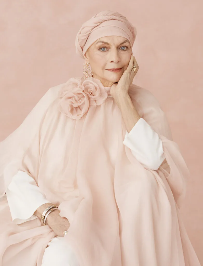 Maggie T in an elegant flowing pink dress