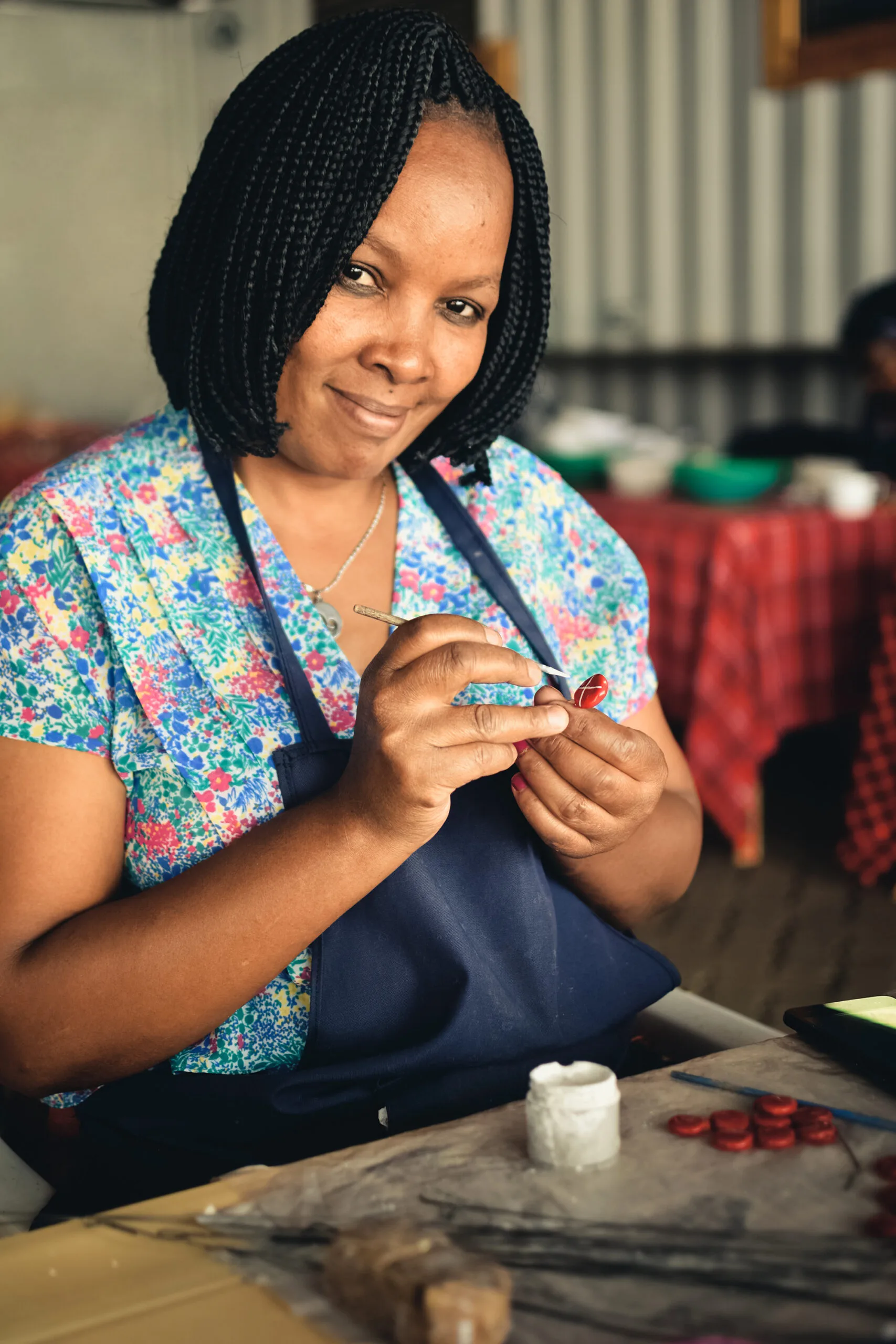 Female artist at the Kazuri Beads Factory in Kenya, a stop of the women-only Kenya tour.
