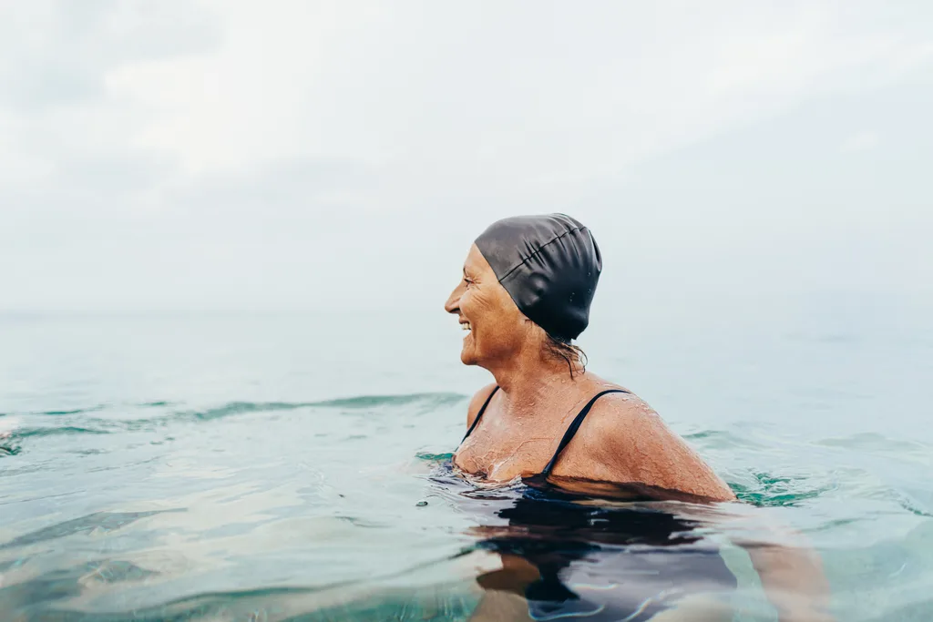 Woman swimming at the beach.