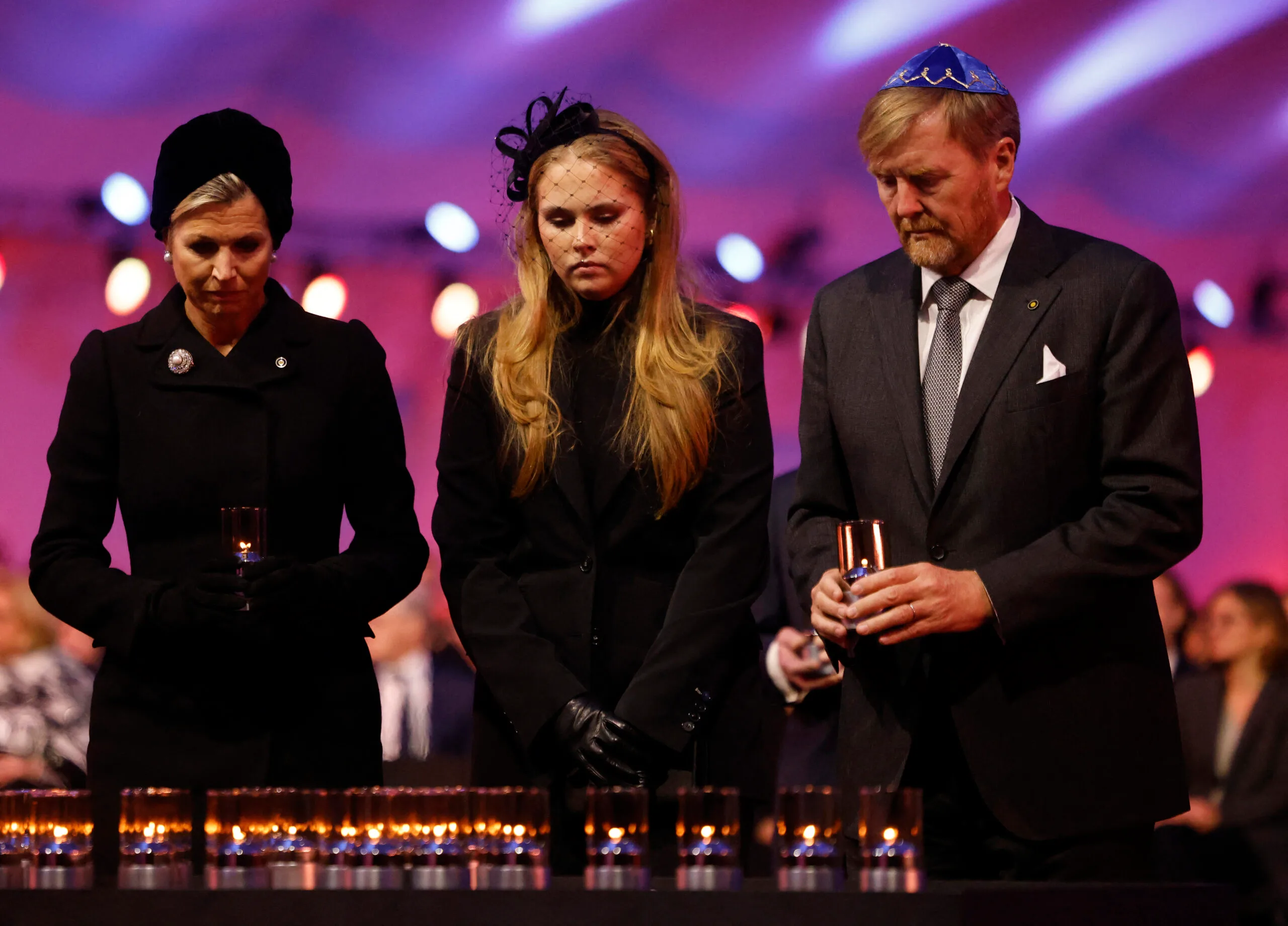 King Willem-Alexander, Queen Maxima and Princess Catharina-Amalia of the Netherlands lay candles in honour of the victims.