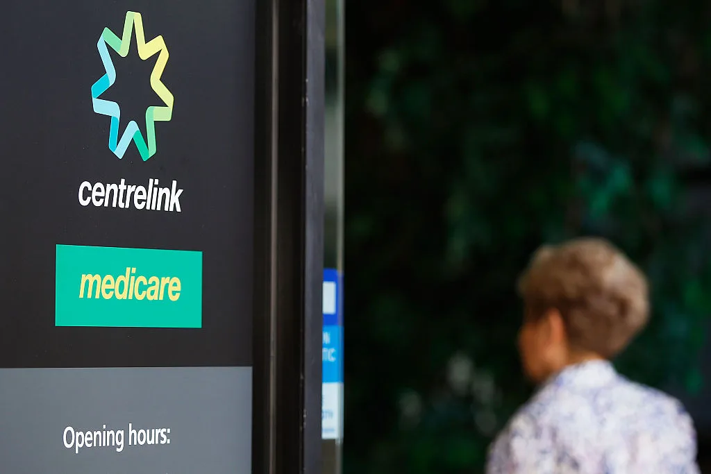 A woman walks into a Medicare Government Office on May 23, 2016 in Sydney, Australia.