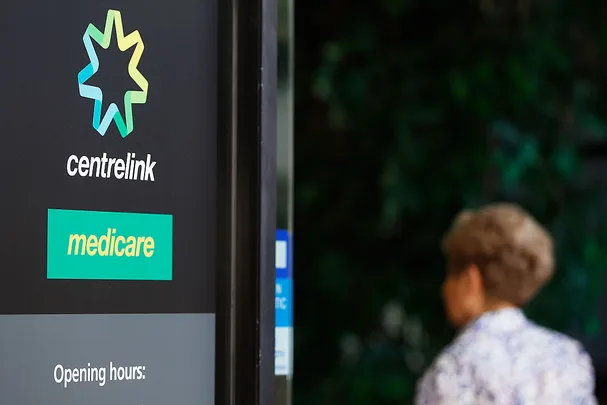A woman walks into a Medicare Government Office on May 23, 2016 in Sydney, Australia.