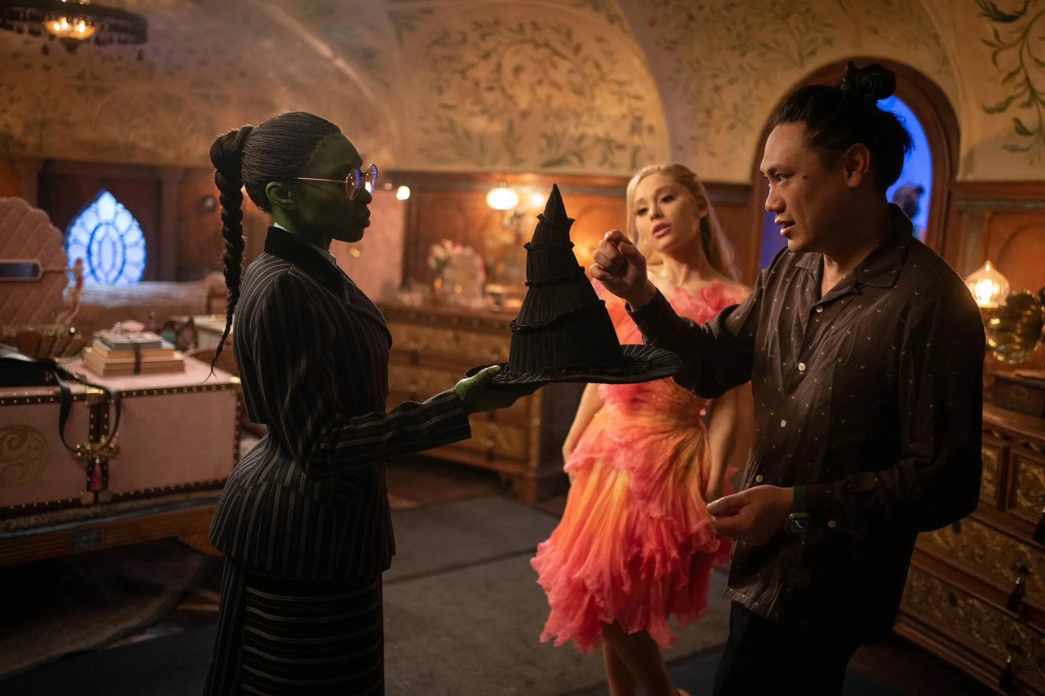 wicked drector jon m chu on set with cynthia erivo and ariana grande