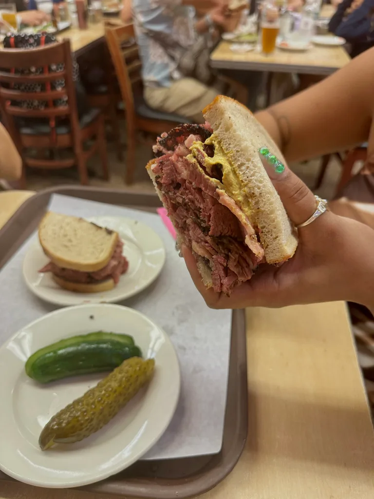 A classic pastrami on rye sandwich from Katz's Delicatessen served with two types of pickles
