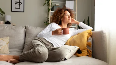 Woman at home drinking tea