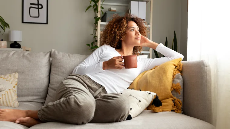 Woman at home drinking tea