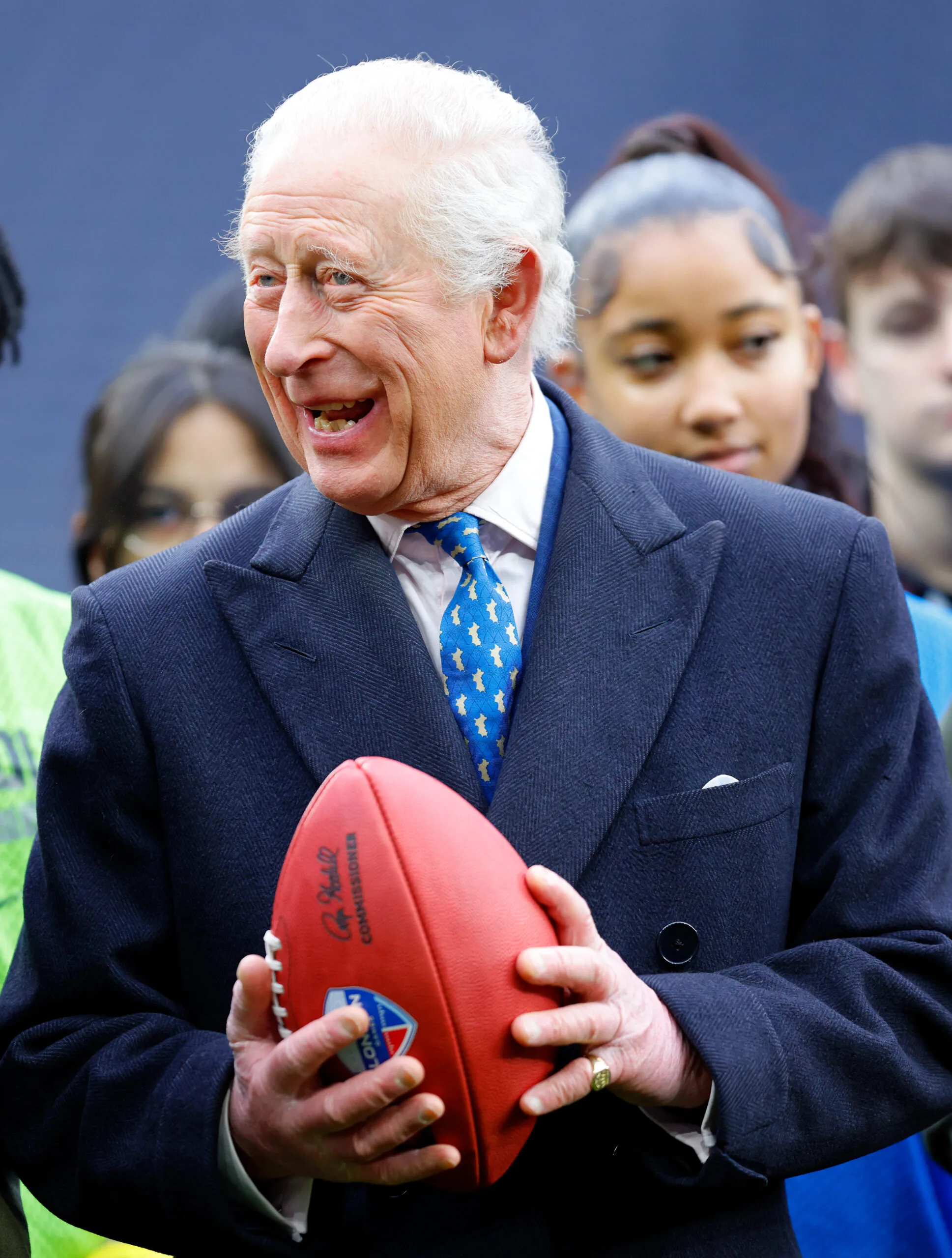 King Charles III is presented with an American football - Royal family sport