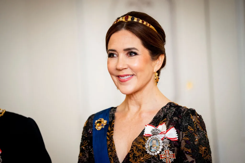 Queen Mary on a royal state visit to Finland wearing a tiara or diadem once owned by Queen Caroline Amalie in the 1800s