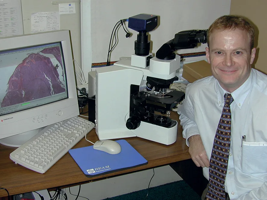 Richard at his desk earlier on in his career before his cancer diagnosis