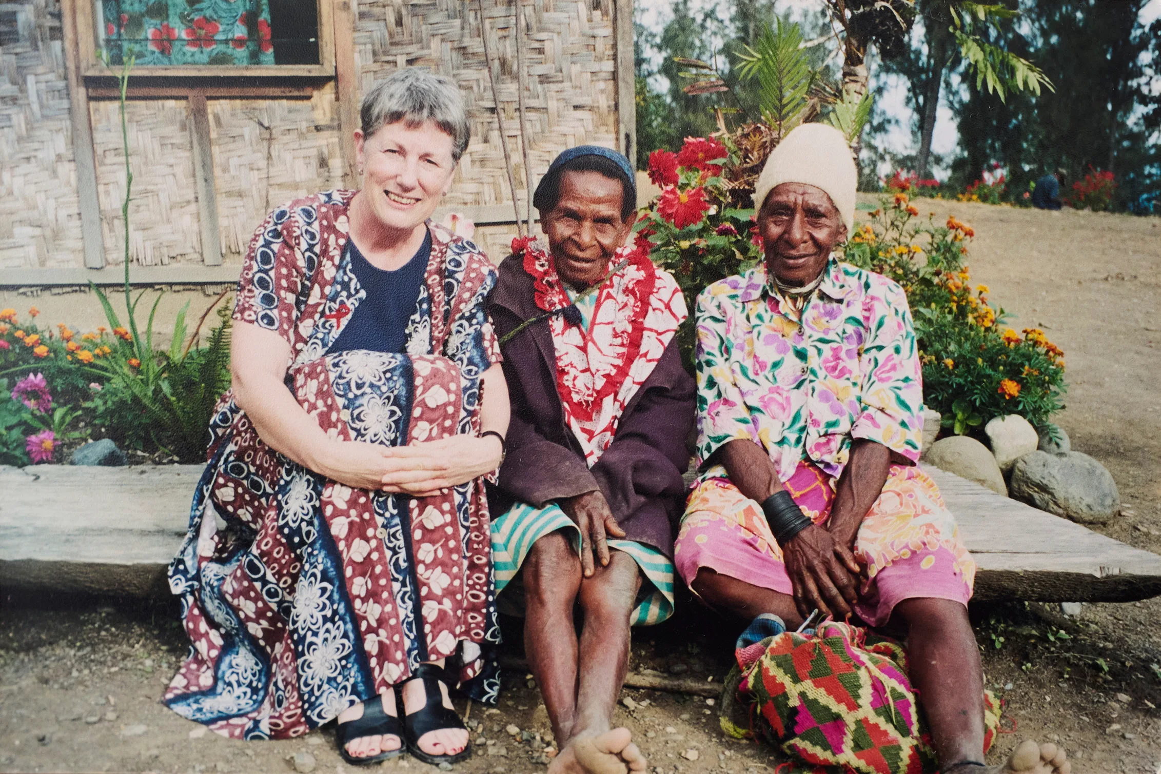 Elizabeth with two people in Papua New Guinea