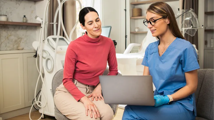 Woman at cosmetic clinic with doctor