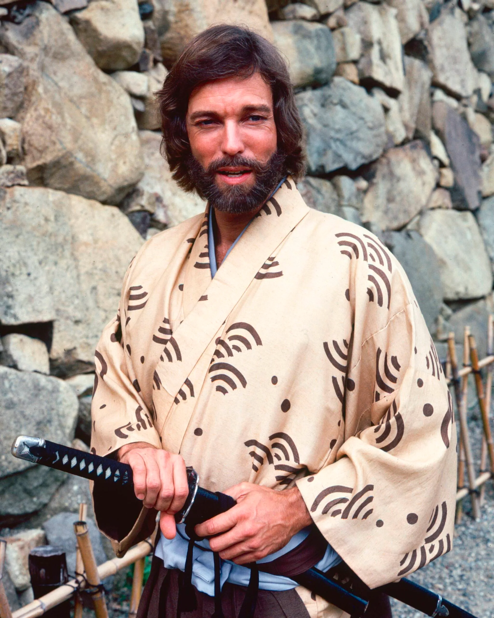 Richard Chamberlain, US actor, wearing a kimono and holding a samurai sword in a publicity portrait issued for the US television series, 'Shogun', Japan, 1980. The mini-series, adapted from the novel by James Clavell, starred Chamberlain as 'Pilot-Major John Blackthorne'. (Photo by Silver Screen Collection/Getty Images)