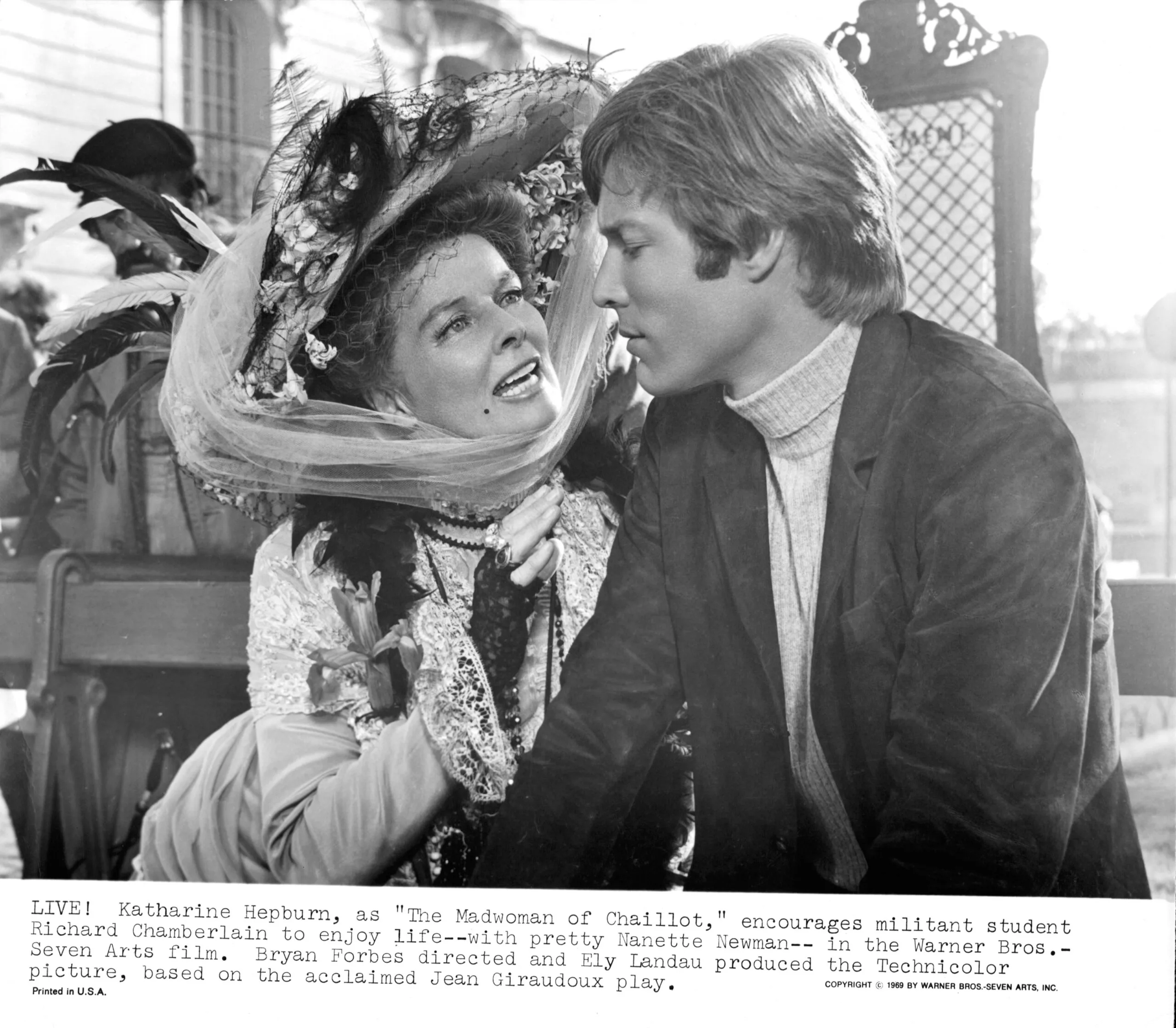 Katharine Hepburn encourages militant Richard Chamberlain to enjoy life in a scene from the film 'The Madwoman Of Chaillot', 1969. (Photo by Warner Brothers/Getty Images)