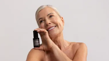 woman holding bottle of presspause