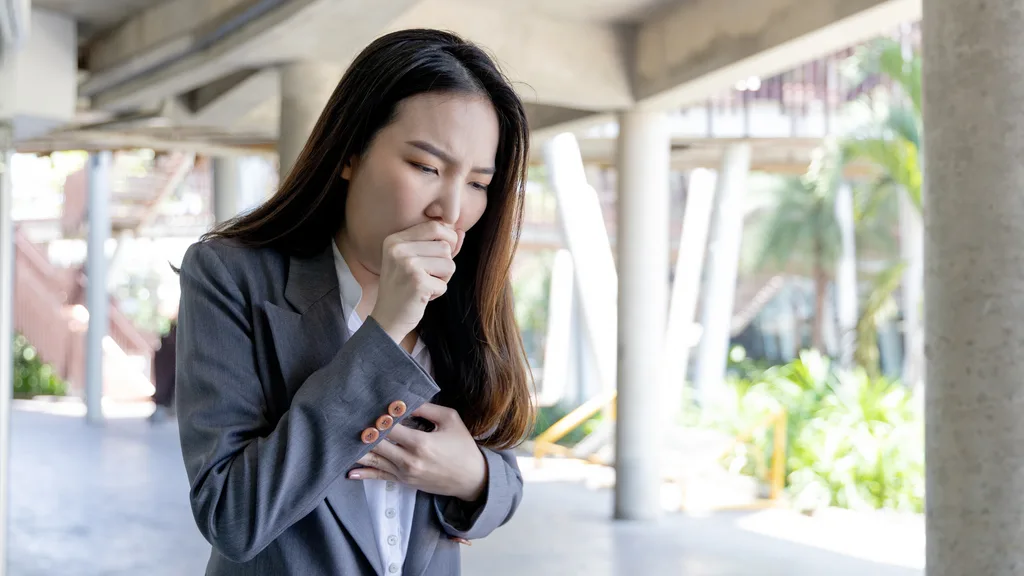 Woman coughing