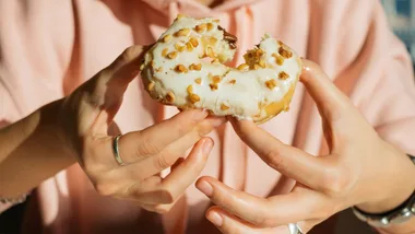 Woman eating doughnut