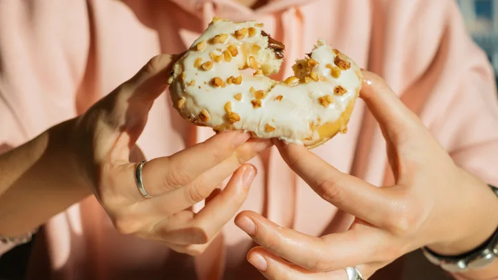 Woman eating doughnut
