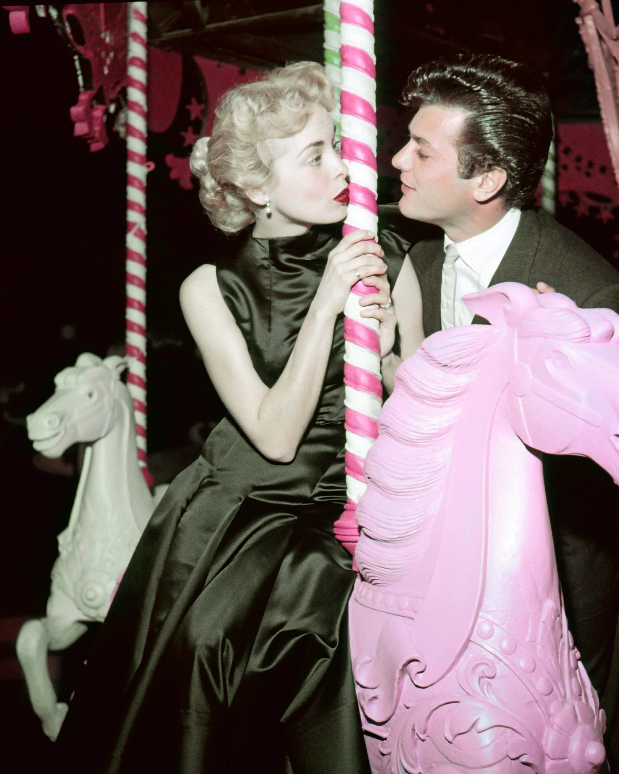 Married American actors Tony Curtis and Janet Leigh on a carousel, circa 1955. (Photo by Silver Screen Collection/Getty Images)