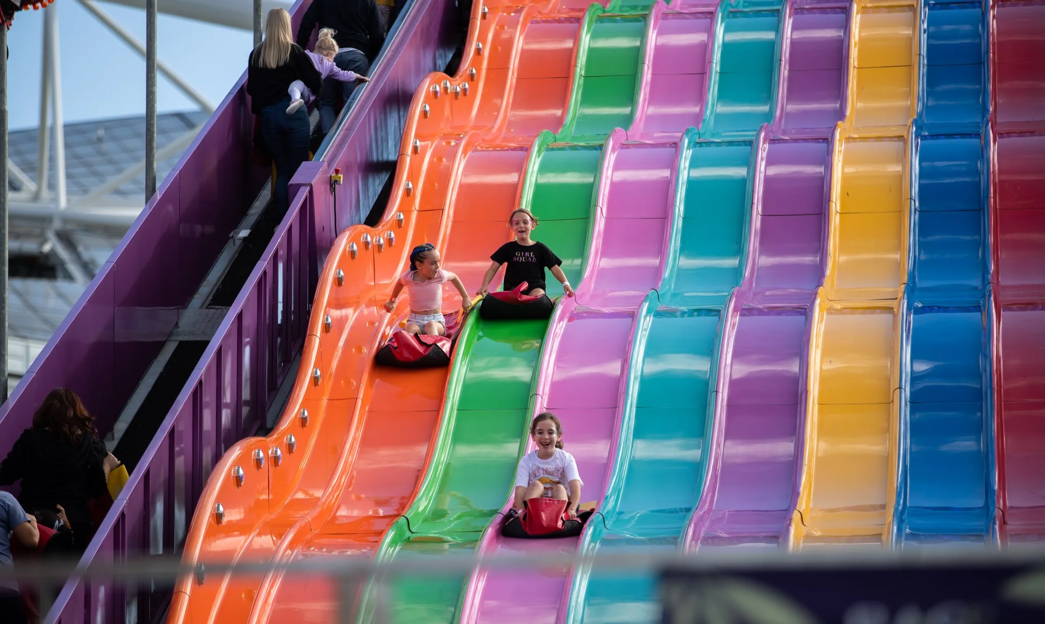 kids going down a giant slide at the easter show