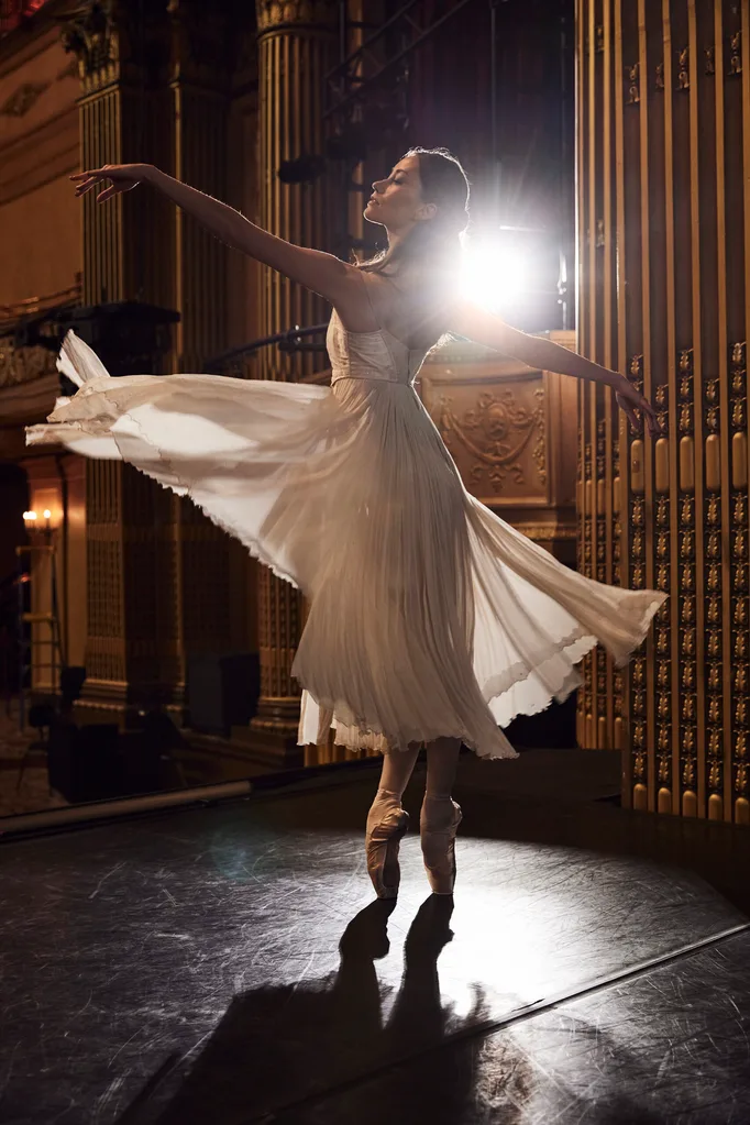 Ballerina for The Nutcracker twirls on stage.