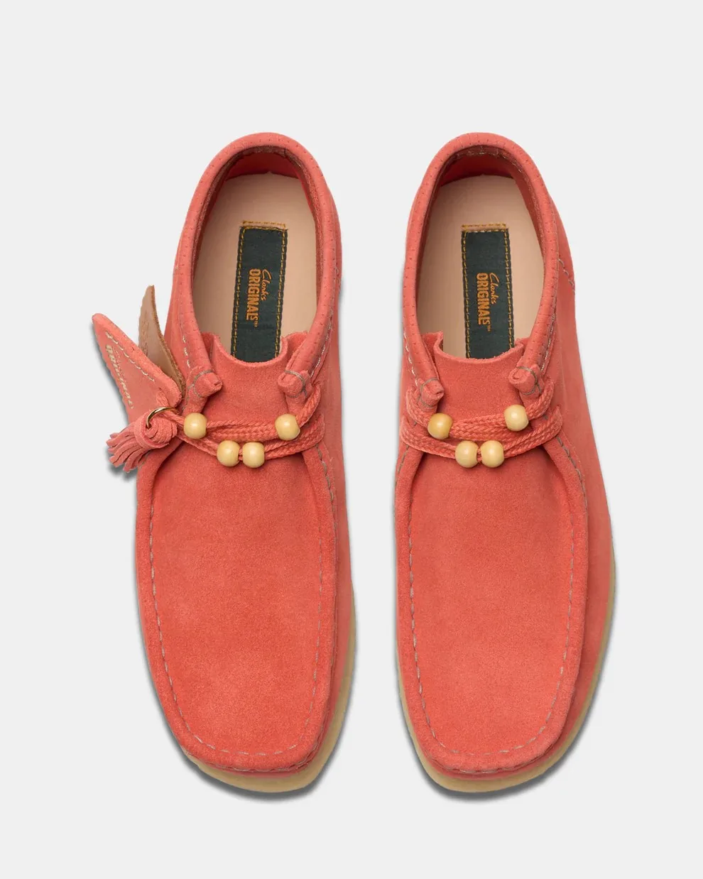 Pair of coral suede flat boots by Clarks