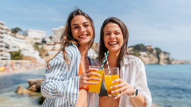 Women on holiday drinking sun beach