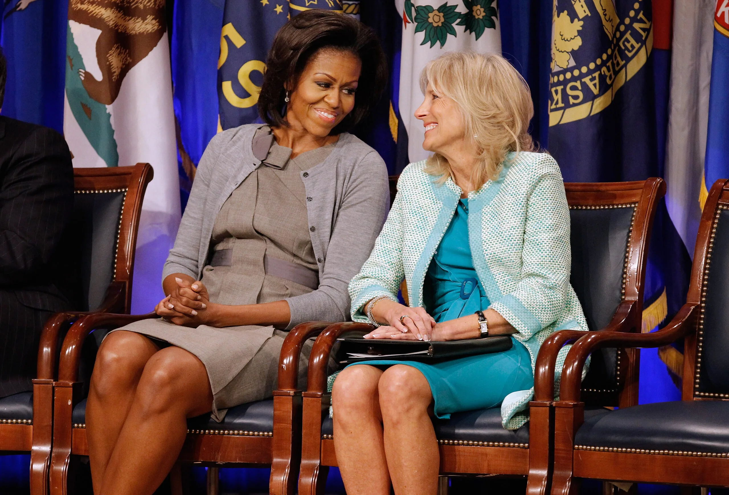 ARLINGTON, VA - FEBRUARY 15:  U.S. first lady Michelle Obama (L) and Dr. Jill Biden attend an event to announce a new report regarding military spouse employment at the Pentagon February 15, 2012 in Arlington, Virginia. The report, "Supporting our Military Families: Best Practices for Streamlining Occupational Licensing Across State Lines," says that military families face a greater financial burden when moving from state to state due to licensing and credentials costs. Obama, Biden and military officials pledged to work to reduce this burden.  (Photo by Chip Somodevilla/Getty Images)