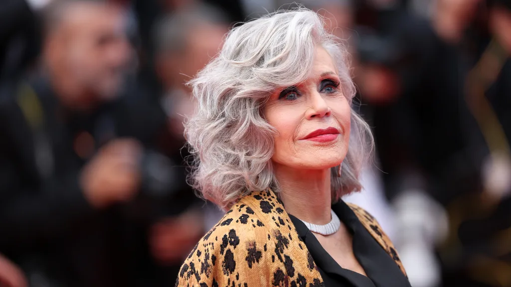 Jane Fonda in a leopard print jacket.