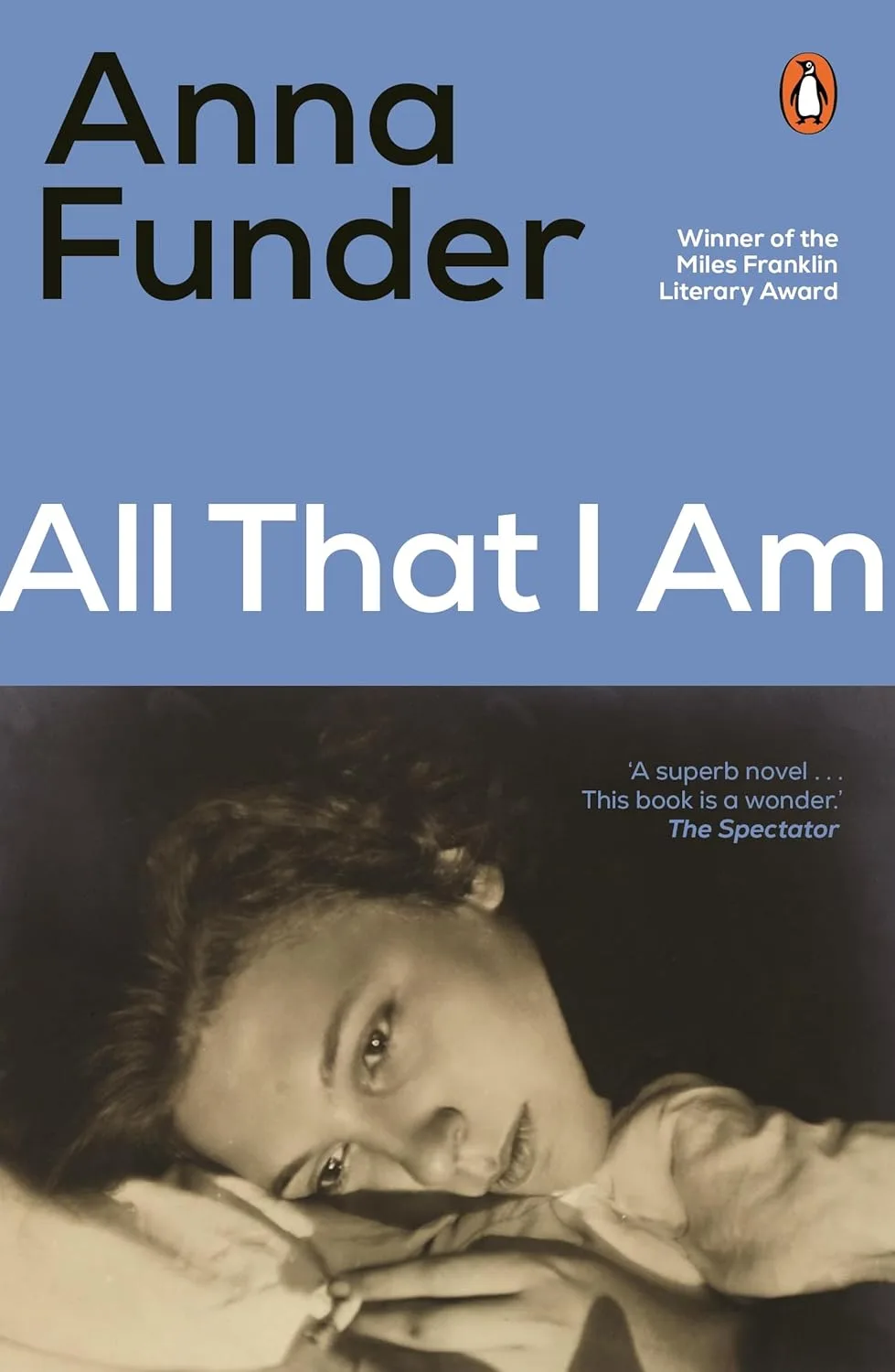 Book cover of All That I Am. A sepia close-up photo of a woman lying down holding a cigarette.