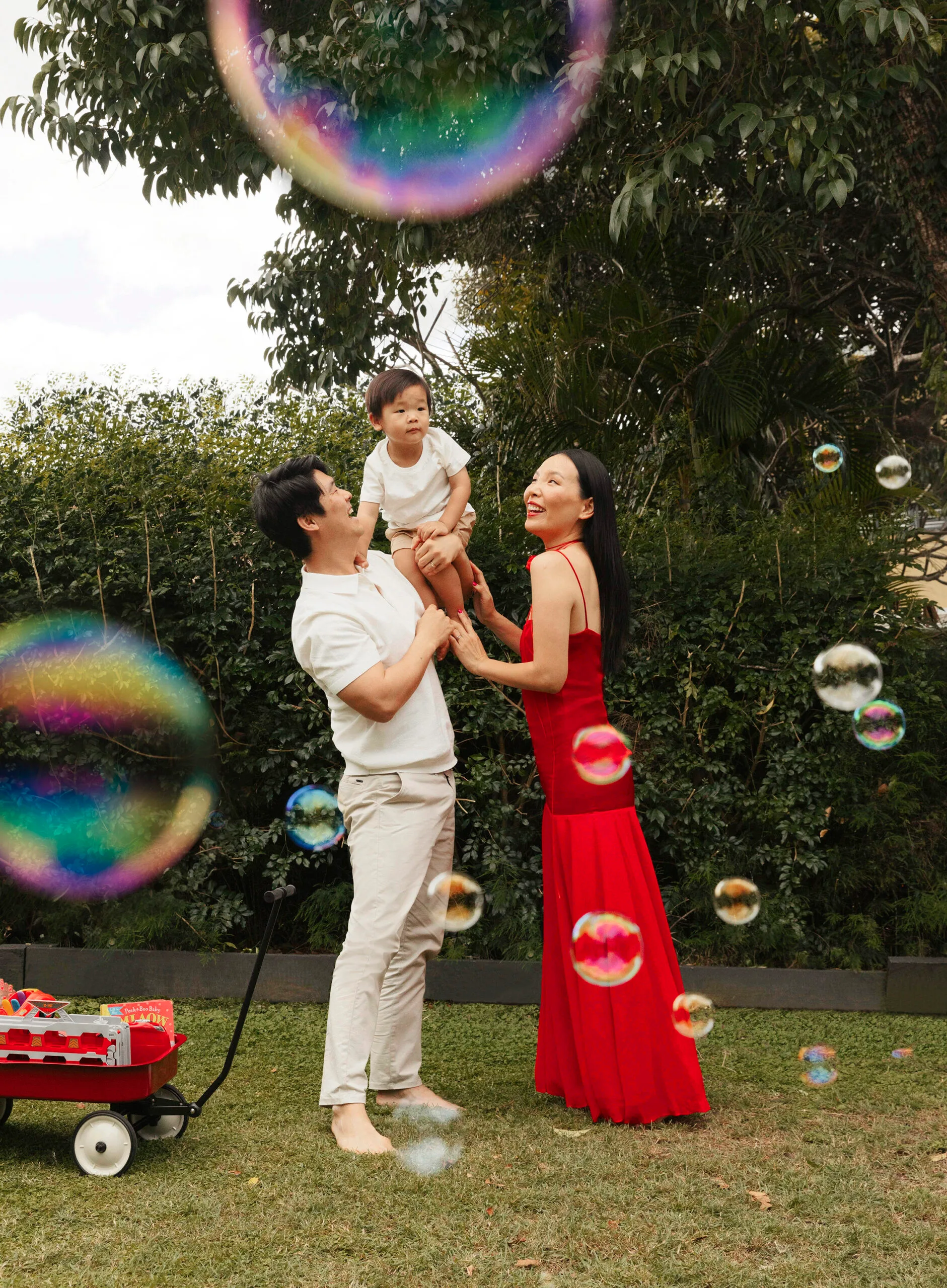 Noah Kim, Harry and Dami Im playing in the backyard
