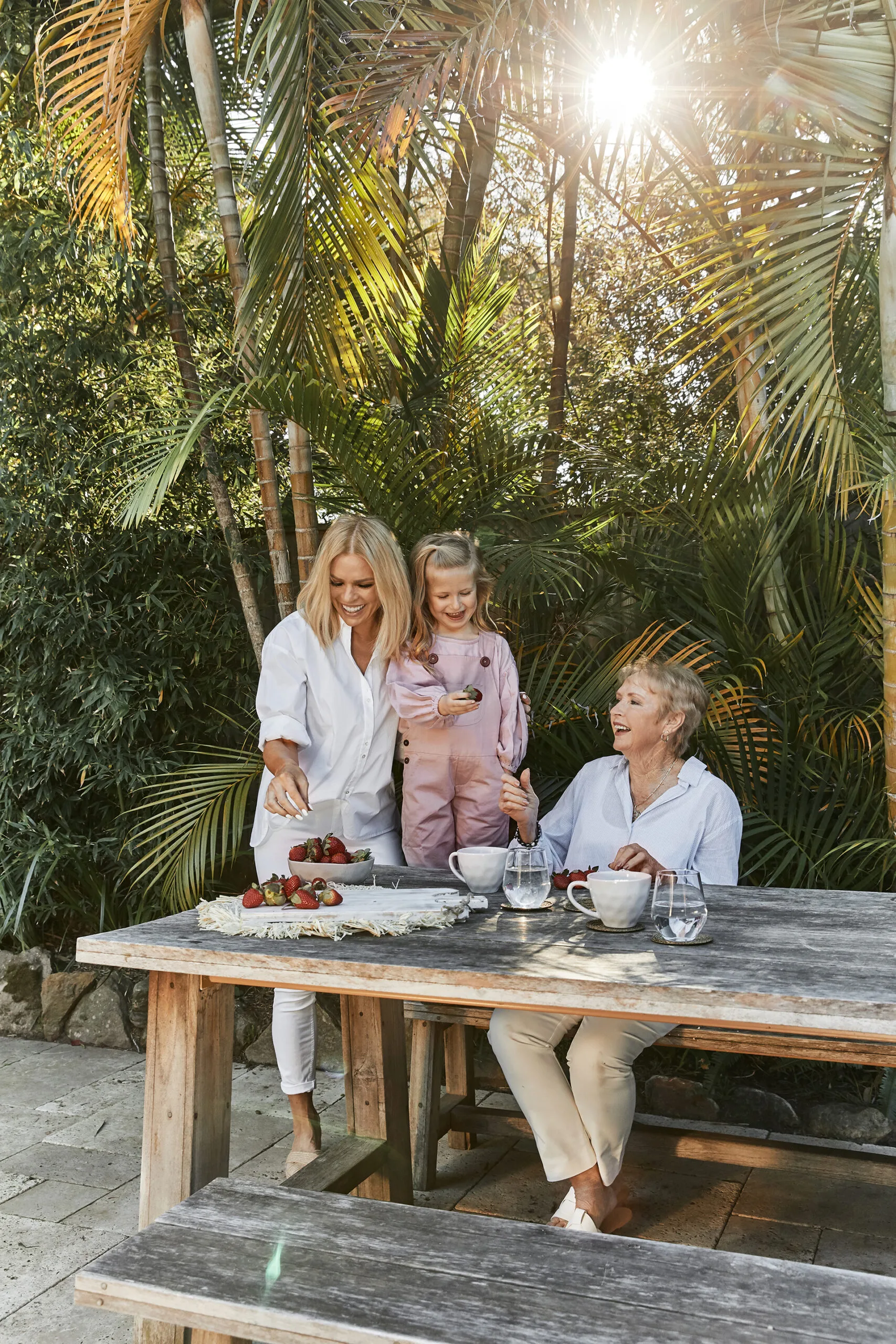 Sonia Kruger sitting with mum Margaret and daughter Maggie