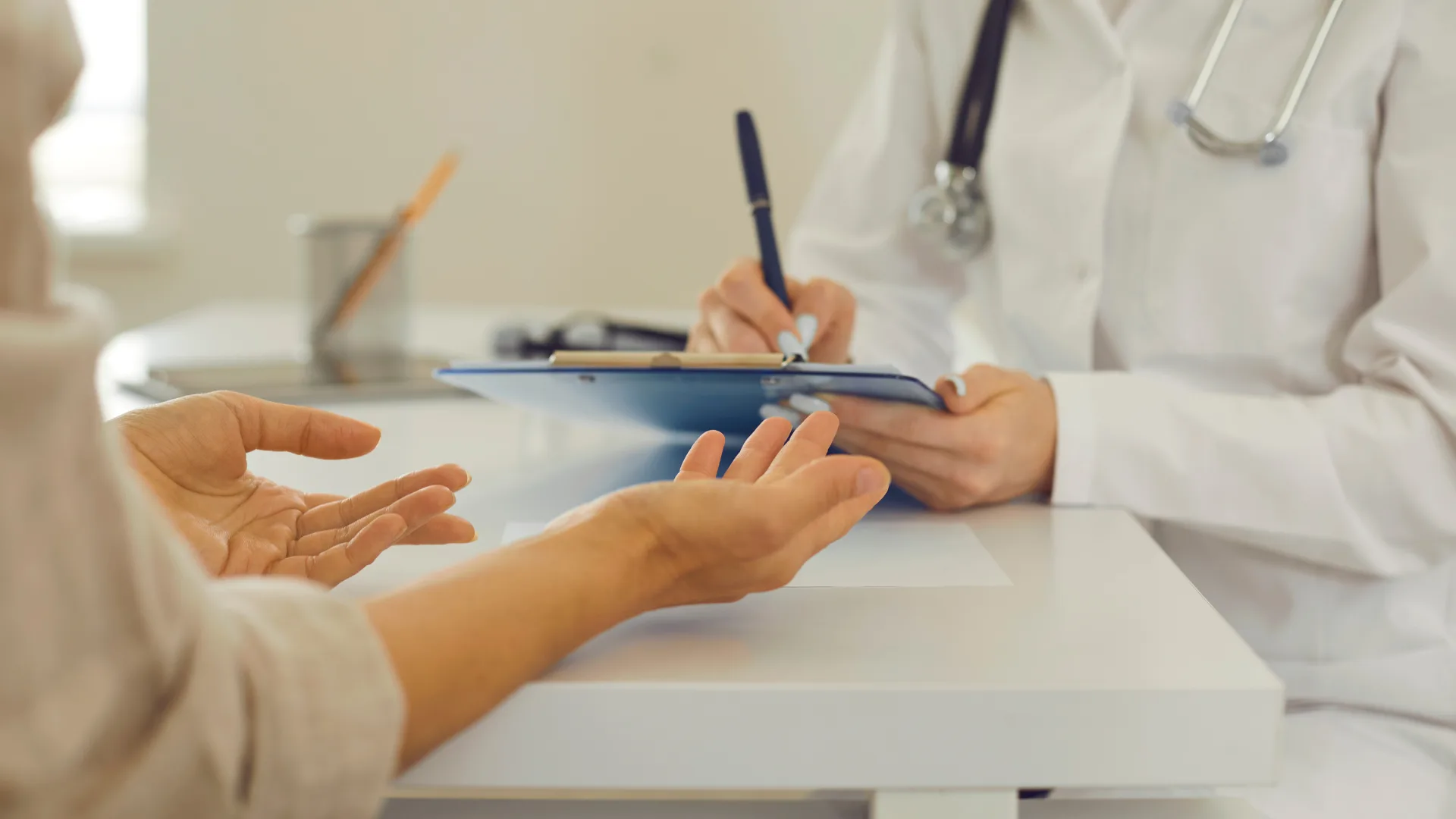 Woman talking to doctor