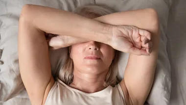 Woman covering face