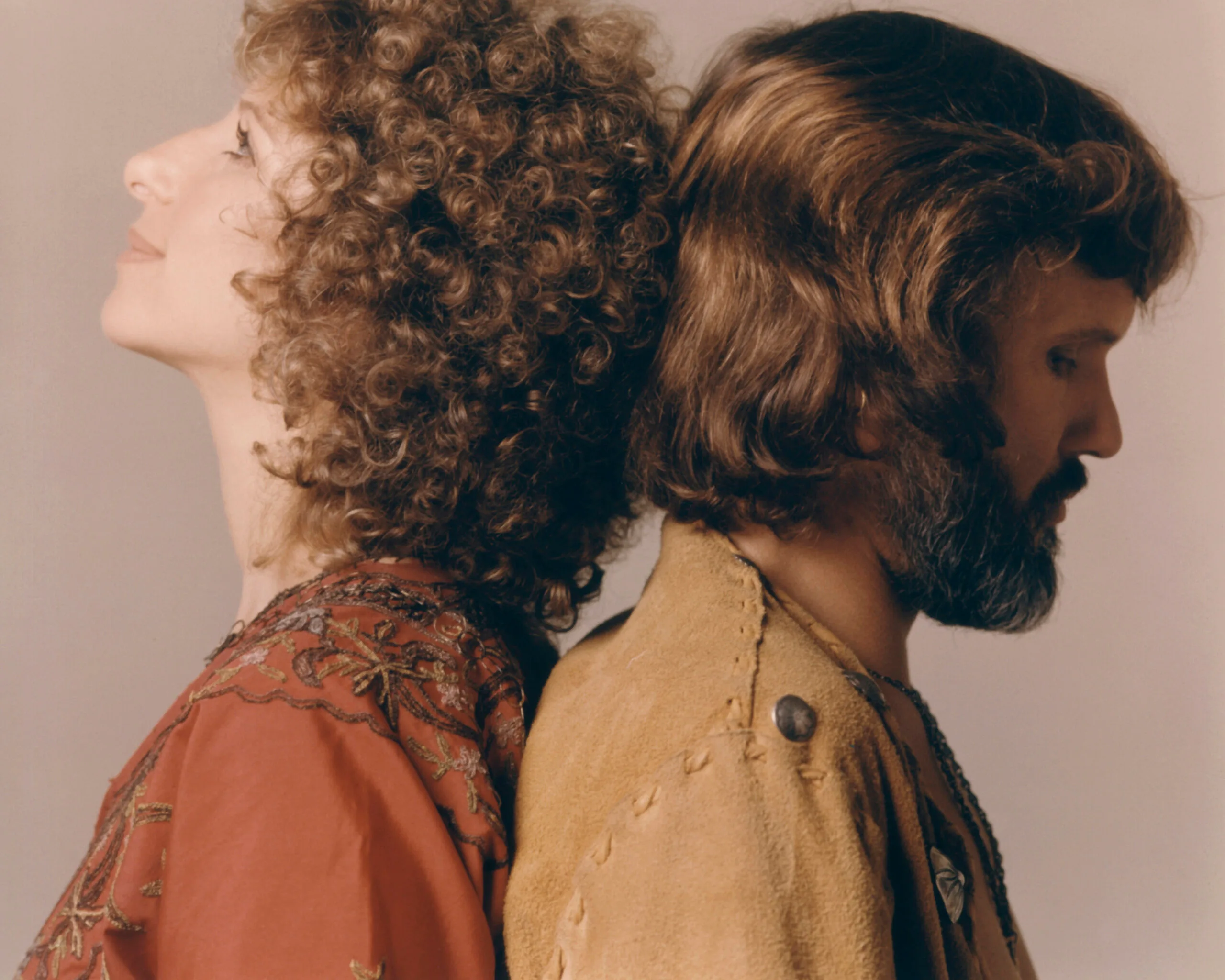 Barbra Streisand and Kris Kristofferson stand back to back from the 1976 film version of 'A Star is Born'. (Photo by Screen Archives/Getty Images)