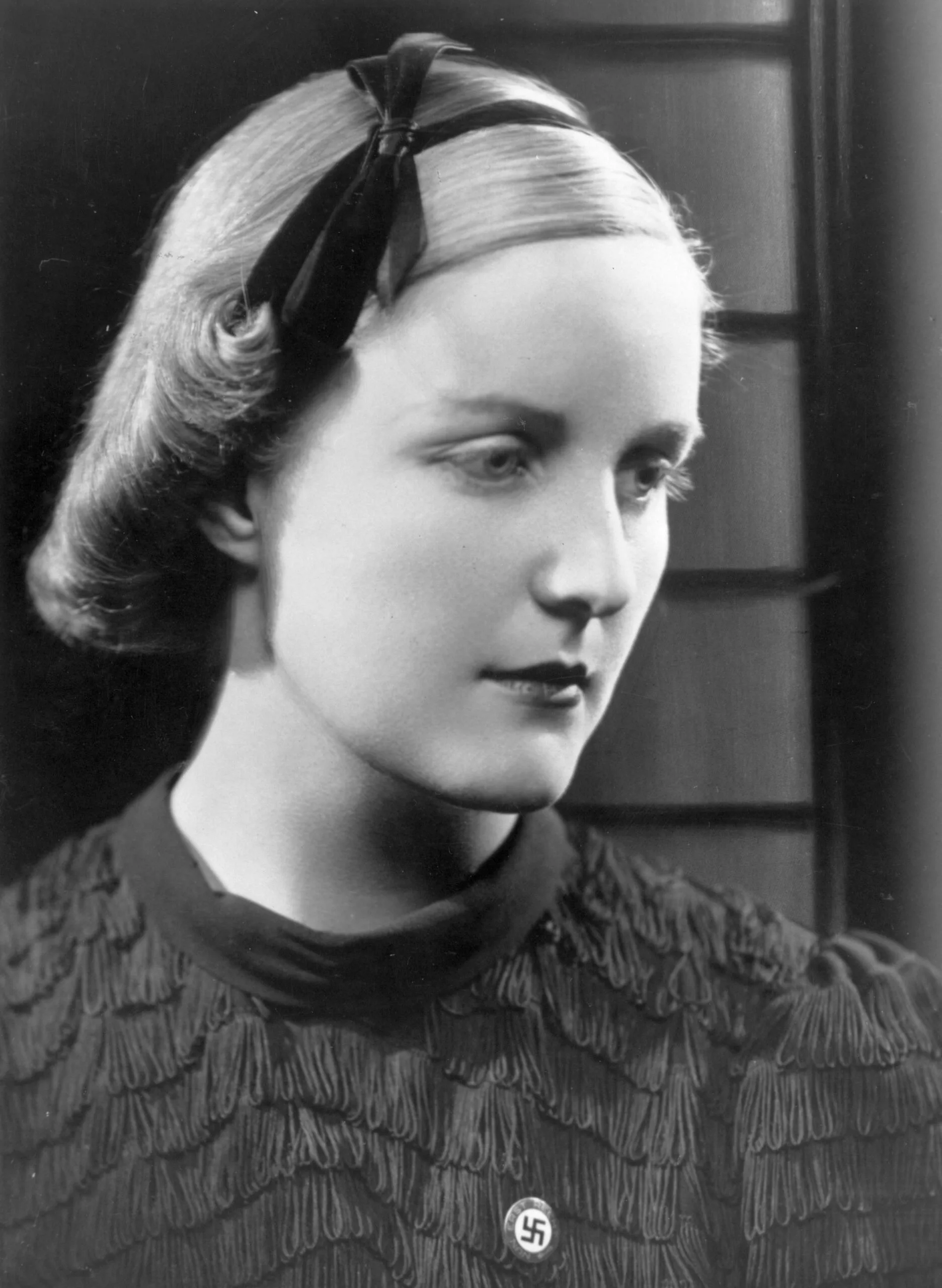 11th August 1938: English socialite Unity Mitford (1914 - 1948), an admirer of Adolf Hitler, wearing a swastika badge. (Photo by Hulton Archive/Getty Images)