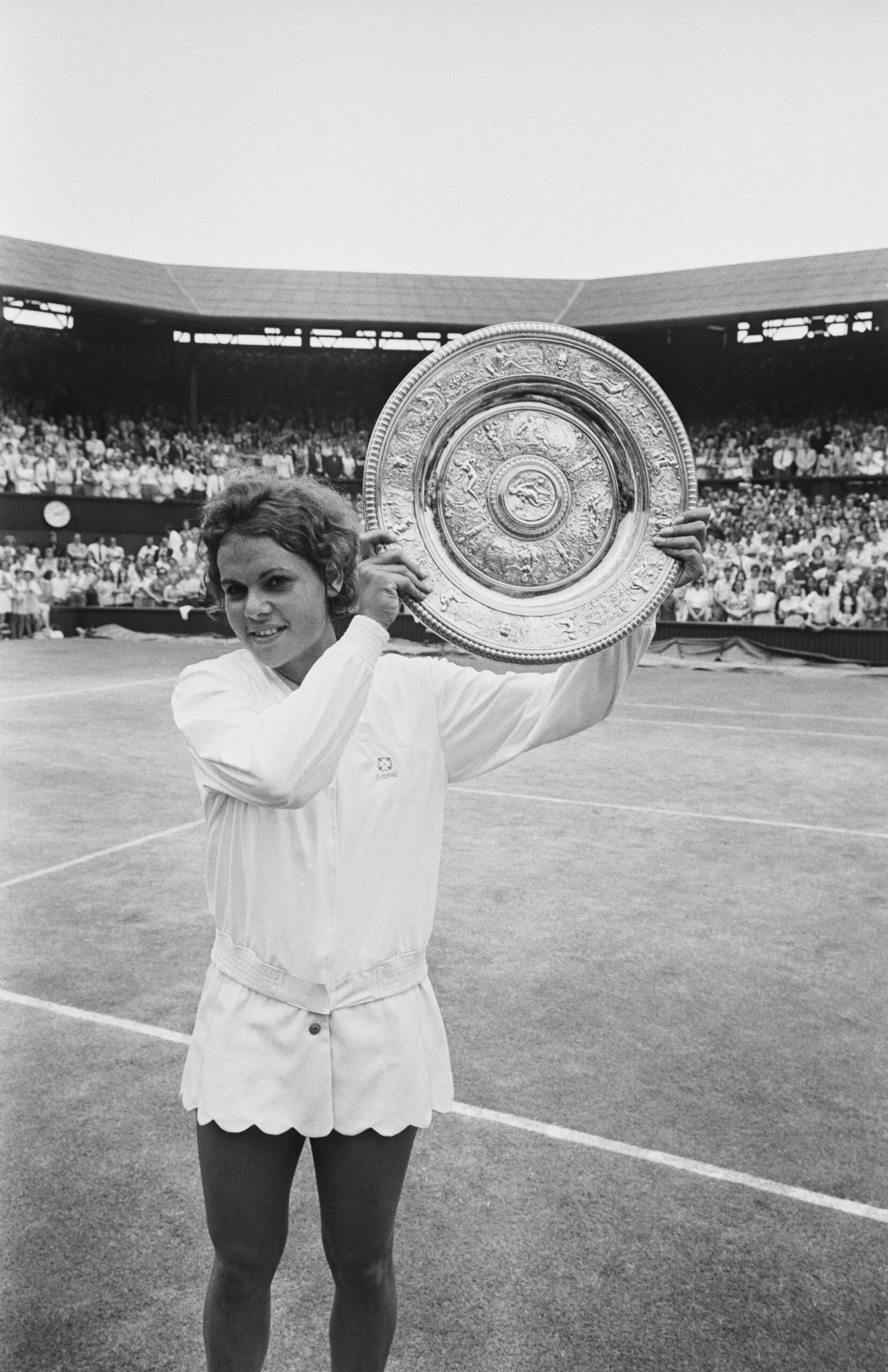 Australian tennis player Evonne Goolagong holds the Women's Singles Trophy after winning the final at the Wimbledon Lawn Tennis Championships, All England Lawn Tennis Club, London, UK, 3rd July 1971. (Photo by Harry Dempster/Daily Express/Getty Images)