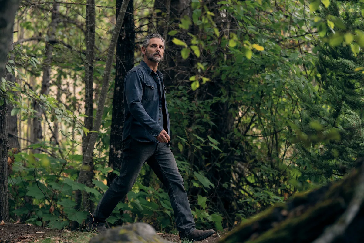 Eric Bana walking through a forest on the set of Untamed