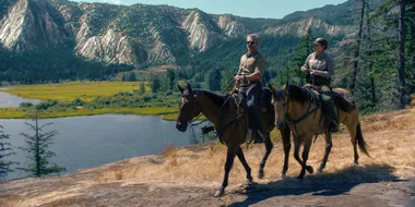 A Eric Bana and a woman on a horseback ride in Yosemite Park on the show Untamed